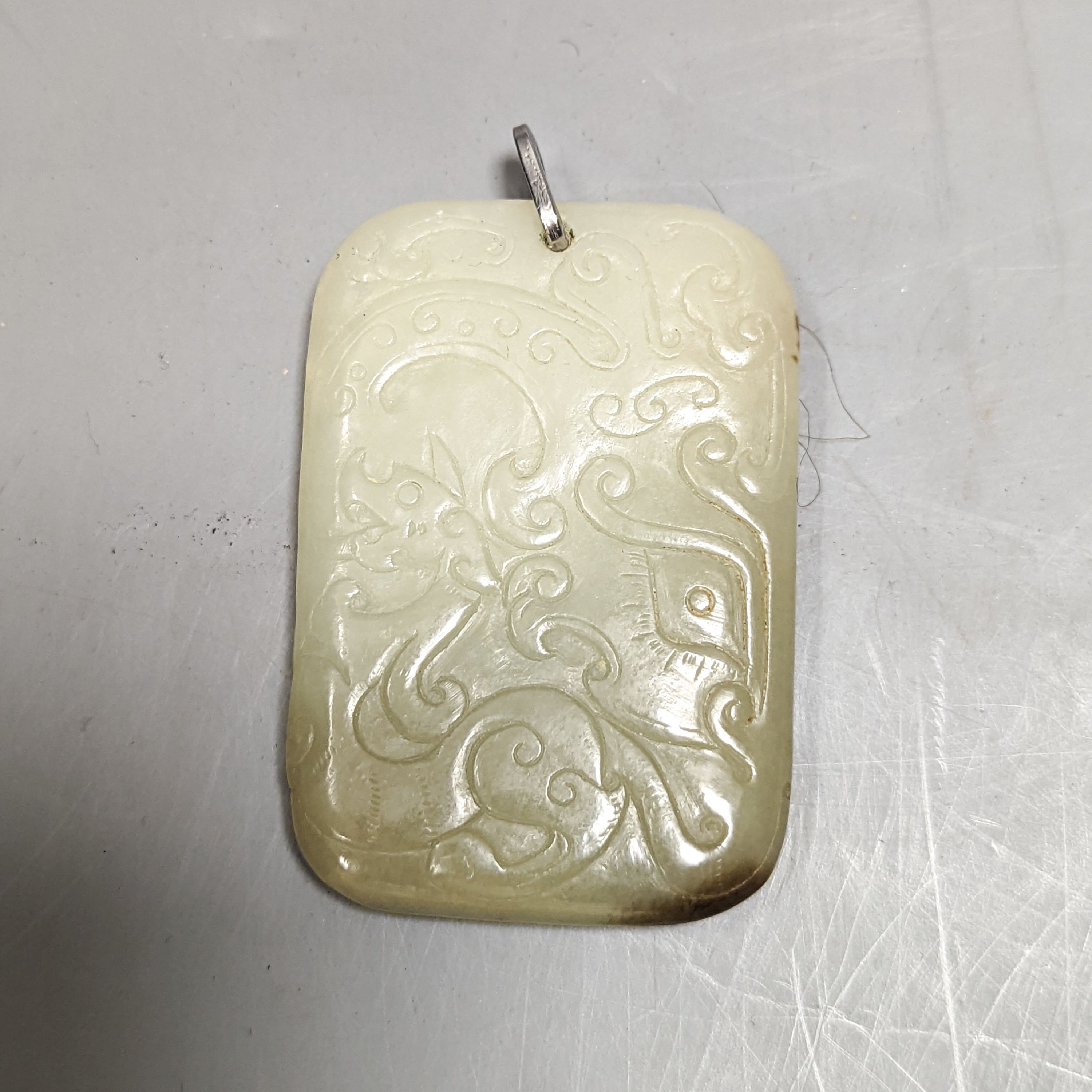 A Chinese carved jade plaque 6.5cm